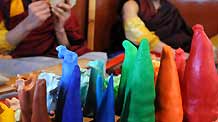 Tibetan lamas make colorful plates at a lama temple in Lhasa, capital of southwest China's Tibet Autonomous Region, on February 19, 2009.