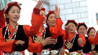 Artists from the Tibetan Drama Troupe perform for local villagers to celebrate the upcoming Tibetan New Year in Ngaqen Village of Lhasa, capital of southwest China's Tibet Autonomous Region, on February 20, 2009.