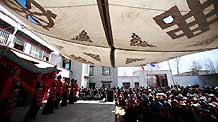 Artists from the Tibetan Drama Troupe of Tibet stage a traditional drama for local villagers to celebrate the upcoming Tibetan New Year in Ngaqen Village of Lhasa, capital of southwest China's Tibet Autonomous Region, on February 20, 2009. The Tibetan New Year falls on February 25 this year according to the traditional Tibetan calendar.