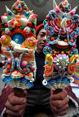 A farmer sells color plates, which are necessary tools for the Tibetan New Year, at a market in Lhasa, capital of southwest China's Tibet Autonomous Region, on February 22, 2009. 