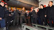 Rescue workers carry a body of a victim at a coal mine in north China's Shanxi Province, on February 22, 2009. More than 40 miners have died after a coal mine blast occurred at about 2:00 AM Sunday at the Tunlan Coal Mine of Shanxi Coking Coal Group in Gujiao City near Taiyuan, capital of north China's Shanxi Province, while rescuers are pulling out the trapped from the shaft, according to a rescuer at the site.