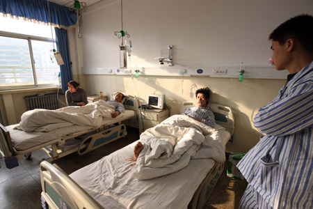 Miners injured in the accident receive treatment in a hospital in north China's Shanxi Province February 23, 2009. 