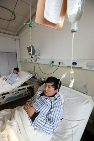 Miners injured in the accident receive treatment in a hospital in north China's Shanxi Province on February 23, 2009. 