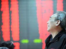 A stock holder reacts in front of a board displaying stocks index in Beijing, capital of China, on February 23, 2009. Chinese equities gained almost 2 percent on Monday as investors expected more stimulus policy on property sector, analysts said. The benchmark Shanghai Composite Index climbed 1.96 percent, or 44.3 points, to 2,305.78. The Shenzhen Component Index was up 3.61 percen to 8,727.7 points.