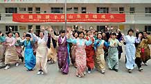 Tibetan students celebrate the Tibetan New Year which falls on February 25 this year at Jinan Tibetan School in Jinan, capital of east China's Shandong Province, on February 24, 2009. Some 200 Tibetan students who study in the coastal province welcomed Tibetan New Year on Tuesday.