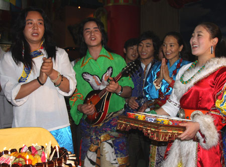 Tibetans who live in Shanghai celebrate the upcoming Tibetan New Year with their ethnic costumes and food in Shanghai, on February 23, 2009. The Tibetan New Year falls on February 25 according to the traditional Tibetan calendar.