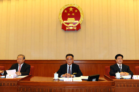 Wu Bangguo (C), chairman of the Standing Committee of the National People's Congress (NPC), presides over the seventh meeting of the 11th NPC Standing Committee in Beijing, capital of China, on February 25, 2009. 