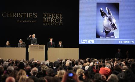 The bronze sculpture of a rabbit's head, which is an ancient Chinese relic, is auctioned in the Grand Palace of Paris in Paris, France, on February 25, 2009. Two controversial ancient Chinese relics including the bronze sculptures of a rat's head and a rabbit's head, were auctioned off on Wednesday night for 14 million euros each by anonymous telephone bidders in Christies's sale of the collection of Yves Saint Laurant and Pierre Berge in Paris. 