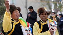 Actors perform Tibetan traditional dance to celebrate the Tibetan New Year in Longwangtan Park in Lhasa, capital of southwest China's Tibet Autonomous Region, on February 25, 2009.