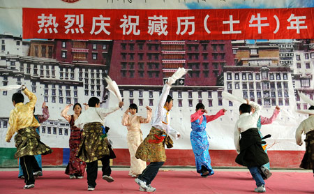 Students of Tibetan ethnic group perform in celebration of the Tibetan New Year at Tibetan School in Jinan, capital of east China's Shandong Province, on February 25, 2009. Tibetans across China are celebrating the 50th Tibetan New Year after the Democratic Reform with their old traditions.