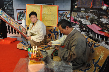 Tibetan craftsmen create butter sculptures at the 50th Anniversary of Democratic Reforms in Tibet Exhibition, which runs from Feb. 24 to April 10 in the Exhibition Center of the Cultural Palace of Nationalities, Beijing. 