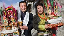 Liu Shengjie (L), a cadre from Beijing, celebrates the Tibetan New Year with his Tibetan friend in Lhasa, capital of southwest China's Tibet Autonomous Region, on February 26, 2009, the second day of the 'earth ox' year on the Tibetan calendar. Officials coming from interior areas to aid the region celebrated the Tibetan New Year together with local Tibetans.