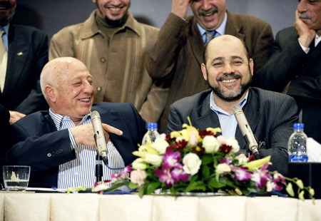 Ahmed Qurei (L), a senior Fatah leader and member of the Fatah delegation for the talks, and Moussa Abu Marzouk, Hamas politburo deputy chief and member of the group's delegation, attend a press conference after an inter-Palestinian national unity dialogue held in Cairo, capital of Egypt, on February 26, 2009. The Palestinian factions attending the dialogue on Thursday have agreed to work for the reconciliation among Palestinians. 