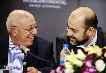 Ahmed Qurei (L), a senior Fatah leader and member of the Fatah delegation for the talks, and Moussa Abu Marzouk, Hamas politburo deputy chief and member of the group's delegation, talk in a press conference after an inter-Palestinian national unity dialogue held in Cairo, capital of Egypt, on February 26, 2009. The Palestinian factions attending the dialogue on Thursday have agreed to work for the reconciliation among Palestinians. 