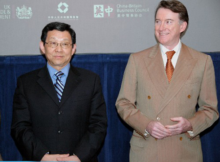 Britain's Business Secretary Lord Mandelson (R) attends a China-Britain Business Council matching event with China's Commerce Minister Chen Deming in London February 27, 2009.