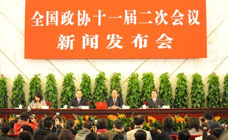 Zhao Qizheng (2nd R), spokesman of the Second Session of the 11th Chinese People's Political Consultative Conference (CPPCC) National Committee, answers questions from journalists during a news conference on the CPPCC session at the Great Hall of the People in Beijing, capital of China, on March 2, 2009. The Second Session of the 11th CPPCC National Committee is scheduled to open on March 3. 