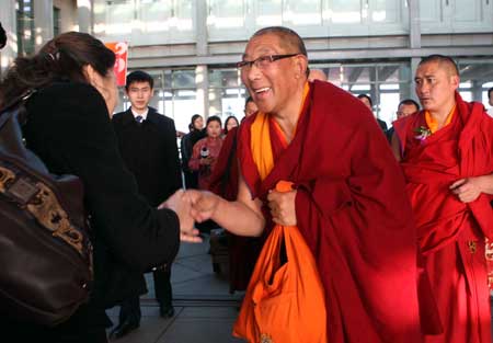 Members of the 11th National Committee of the Chinese People's Political Consultative Conference (CPPCC) from southwest China's Tibet Autonomous Region arrive in Beijing, capital of China, on March 1, 2009.