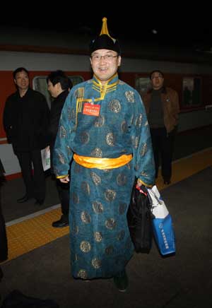 A member of the 11th National Committee of the Chinese People's Political Consultative Conference (CPPCC) from north China's Inner Mongolia Autonomous Region arrives in Beijing, capital of China, March 1, 2009. 