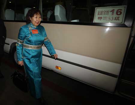 A member of the 11th National Committee of the Chinese People's Political Consultative Conference (CPPCC) from north China's Inner Mongolia Autonomous Region arrives in Beijing, capital of China, on March 1, 2009. 