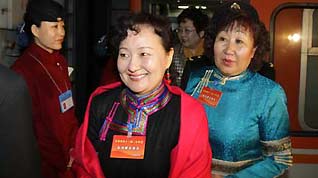 Members of the 11th National Committee of the Chinese People's Political Consultative Conference (CPPCC) from north China's Inner Mongolia Autonomous Region arrive in Beijing, capital of China, on March 1, 2009.