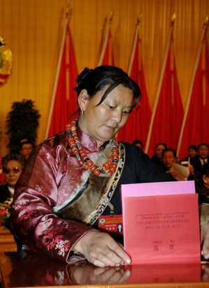 A woman of the Tibetan ethnic group votes during an election in southwest China's Tibet Autonomous Region, on January 20, 2008. 