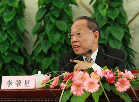 Li Zhaoxing, spokesman for the Second Session of the 11th National People's Congress (NPC), answers questions from journalists during the news conference on the Second Session of the 11th NPC at the Great Hall of the People in Beijing, capital of China, on March 4, 2009. 