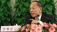 Li Zhaoxing, spokesman for the Second Session of the 11th National People's Congress (NPC), answers questions from journalists during the news conference on the Second Session of the 11th NPC at the Great Hall of the People in Beijing, capital of China, on March 4, 2009.