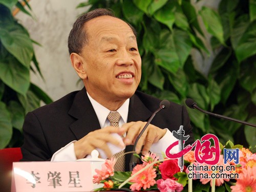 Li Zhaoxing, spokesman for the Second Session of the 11th National People's Congress (NPC), answers questions from journalists during the news conference on the Second Session of the 11th NPC at the Great Hall of the People in Beijing, capital of China, on March 4, 2009. 