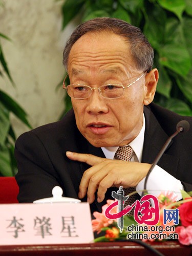 Li Zhaoxing, spokesman for the Second Session of the 11th National People's Congress (NPC), answers questions from journalists during the news conference on the Second Session of the 11th NPC at the Great Hall of the People in Beijing, capital of China, on March 4, 2009. 