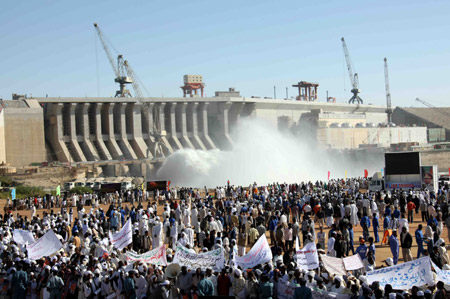 Local people come to attend a celebration as the Merowe Dame began to generate electricity, Merowe, Sudan, on March 3, 2009. Merowe Dam, the longest of its kind on the world famous Nile river in Sudan's Northern province, some 450 km north of the capital city Khartoum. 