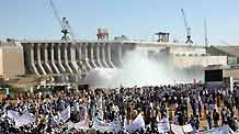 Local people come to attend a celebration as the Merowe Dam began to generate electricity, Merowe, Sudan, on March 3, 2009. Merowe Dam, the longest of its kind on the world famous Nile river in Sudan's Northern province, some 450 km north of the capital city Khartoum.