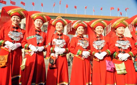 Attendants take photos outside the Great Hall of the People in Beijing, capital of China, on March 5, 2009. The Second Session of the 11th National People's Congress (NPC) opened on Thursday.