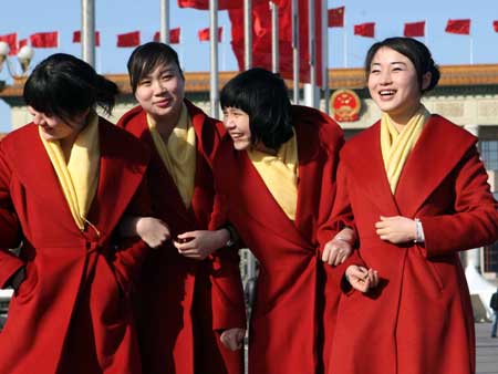 Attendants chat in front of the Great Hall of the People in Beijing, capital of China, on March 5, 2009. The Second Session of the 11th National People's Congress (NPC) opened on Thursday. 