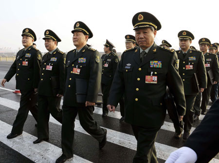 Deputies to the Second Session of the 11th National People's Congress (NPC) walk to the Great Hall of the People in Beijing, capital of China, on March 5, 2009. The Second Session of the 11th NPC opens on Thursday.