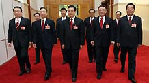 Top Communist Party of China (CPC) and state leaders Hu Jintao (C, Front), Wu Bangguo (3rd R), Wen Jiabao (3rd L), Jia Qinglin (1st R), Li Changchun (1st L), Xi Jinping (4th L), Li Keqiang (4th R), He Guoqiang (2nd L) and Zhou Yongkang (2nd R) walk to attend the opening meeting of the Second Session of the 11th National People's Congress (NPC) at the Great Hall of the People in Beijing, capital of China, on March 5, 2009.