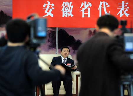 Wang Sanyun, deputy to the Second Session of the 11th National People's Congress (NPC) from east China's Anhui Province, speaks while deliberating the government work report in Beijing, capital of China, on March 6, 2009. 