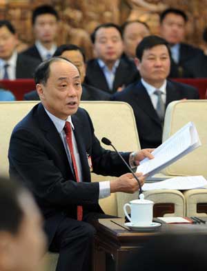 Shen Weiguo, deputy to the Second Session of the 11th National People's Congress (NPC) from east China's Anhui Province, speaks while deliberating the government work report in Beijing, capital of China, on March 6, 2009.