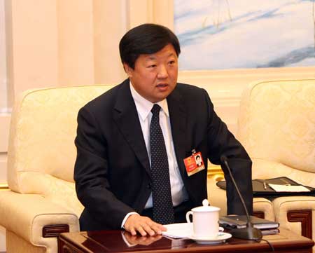 Song Xibin, deputy to the Second Session of the 11th National People's Congress (NPC) from northeast China's Heilongjiang Province, speaks while deliberating the government work report in Beijing, capital of China, on March 6, 2009. 