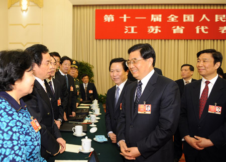 Chinese President Hu Jintao (front R), meets with deputies to the Second Session of the 11th National People's Congress (NPC) from east China's Jiangsu Province, in Beijing, capital of China, on March 5, 2009. Hu Jintao joined in the panel discussion of Jiangsu delegation on the opening day of the Second Session of the 11th NPC. 