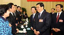 Chinese President Hu Jintao (front R), meets with deputies to the Second Session of the 11th National People's Congress (NPC) from east China's Jiangsu Province, in Beijing, capital of China, on March 5, 2009. Hu Jintao joined in the panel discussion of Jiangsu delegation on the opening day of the Second Session of the 11th NPC.