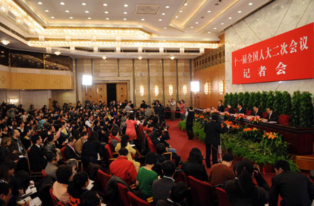 Press conference on dealing with the global financial crisis and maintaining steady and relatively rapid economic growth is held by the Second Session of the 11th National People's Congress (NPC) at the Great Hall of the People in Beijing, capital of China, March 6, 2009. 
