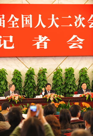 Zhang Ping (C), minister in charge of the National Development and Reform Commission of China, Chinese Finance Minister Xie Xuren (R) and Zhou Xiaochuan (L), governor of the People's Bank of China, attend a press conference on dealing with the global financial crisis and maintaining steady and relatively rapid economic growth held by the Second Session of the 11th National People's Congress (NPC) at the Great Hall of the People in Beijing, capital of China, on March 6, 2009. 