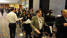 Job seekers line up to enter the job fair at the Marriott Marquis hotel in Manhattan, New York, the United States, on March 5, 2009.