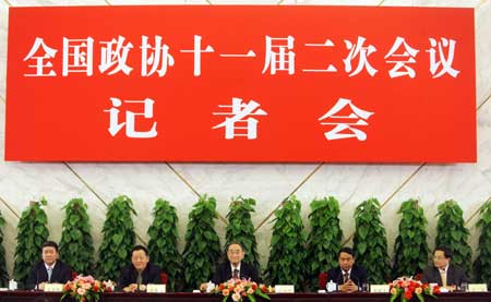 (From L to R) Wang Wenbiao, Li Deshui, Li Yining, Chen Xiwen and Fang Fang, members of the 11th National Committee of the Chinese People&apos;s Political Consultative Conference (CPPCC), attend a press conference on proposals for promoting steady and relatively rapid economic growth held by the Second Session of the 11th National Committee of the CPPCC at the Great Hall of the People in Beijing, capital of China, on March 6, 2009. 