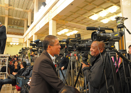 Journalists prepare prior to Chinese Foreign Minister Yang Jiechi's meeting with the press held by the Second Session of the 11th National People's Congress (NPC) at the Great Hall of the People in Beijing, capital of China, March 7, 2009. 