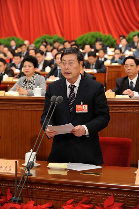 Huang Mengfu, vice chairman of the National Committee of the Chinese People's Political Consultative Conference (CPPCC), presides over the second plenary meeting of the Second Session of the 11th National Committee of the CPPCC at the Great Hall of the People in Beijing, capital of China, on March 7, 2009. 