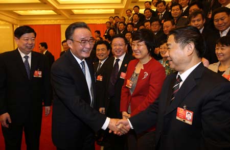 Wu Bangguo (front L), member of the Standing Committee of the Political Bureau of the Communist Party of China (CPC) Central Committee and also chairman of the Standing Committee of the National People's Congress (NPC), attends the panel discussion of deputies to the Second Session of the 11th NPC from east China's Shandong Province, in Beijing, capital of China, on March 7, 2009. 