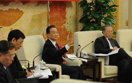 Chinese Premier Wen Jiabao (2nd R) attends the panel discussion of deputies to the Second Session of the 11th National People's Congress (NPC) from central China's Hubei Province, in Beijing, capital of China, on March 7, 2009.