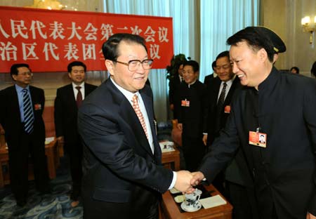 Li Changchun (front L), member of the Standing Committee of the Political Bureau of the Communist Party of China (CPC) Central Committee, attends the panel discussion of deputies to the Second Session of the 11th National People's Congress (NPC) from northwest China's Ningxia Hui Autonomous Region, in Beijing, capital of China, on March 7, 2009. 