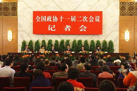 Wan Jifei, Zhou Hanmin, Cheng Yuechong, and Yang Lan, members of the 11th National Committee of the Chinese People's Political Consultative Conference (CPPCC), attend a press conference on promoting World EXPO 2010 Shanghai China held by the Second Session of the 11th National Committee of the CPPCC in Beijing, capital of China, on March 8, 2009.